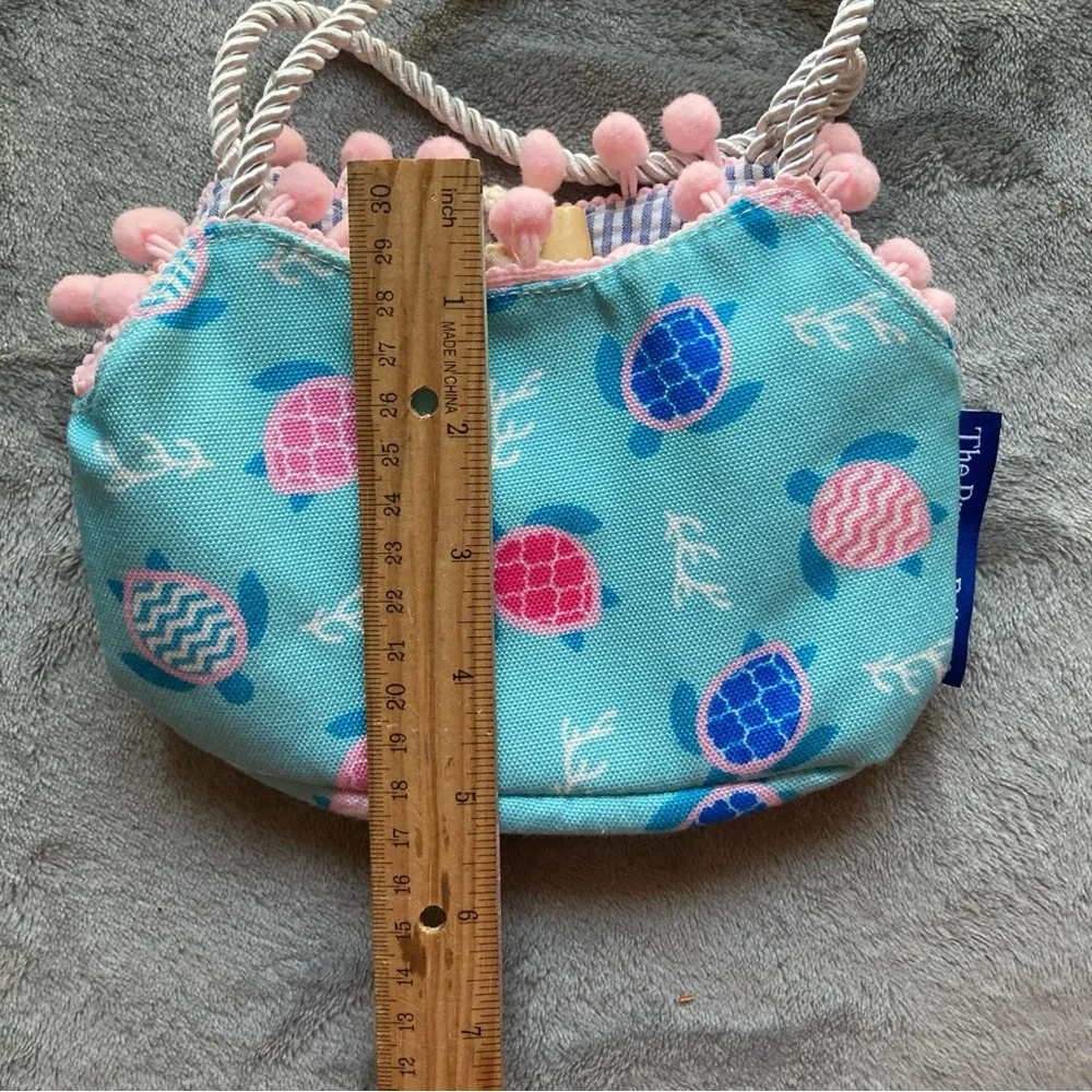 The Preppy Pelican Child's Bag by The Petting Zoo with Turtle Print & Pom Poms